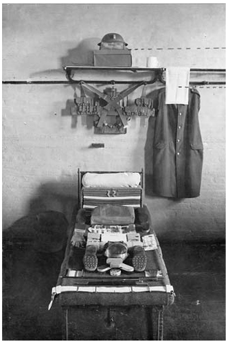A soldier's kit laid out for inspection in the 1920s image